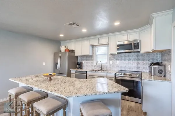 a view of wooden floor in kitchen