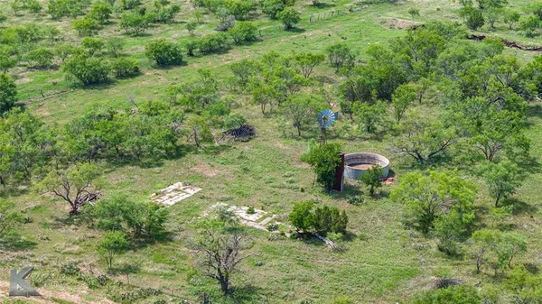 a view of a big yard with an outdoor space