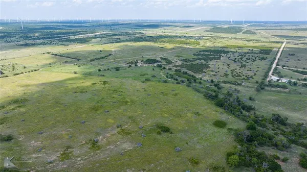 a view of a field with an outdoor space