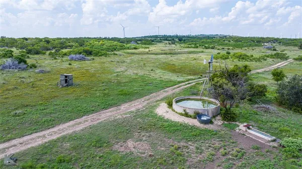 a view of a large body of water with a building in the background