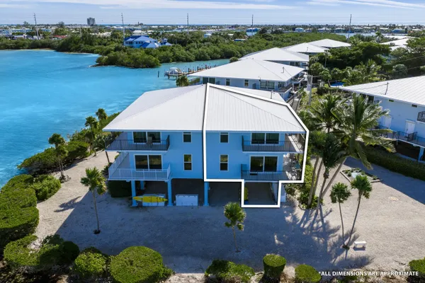 an aerial view of house with yard