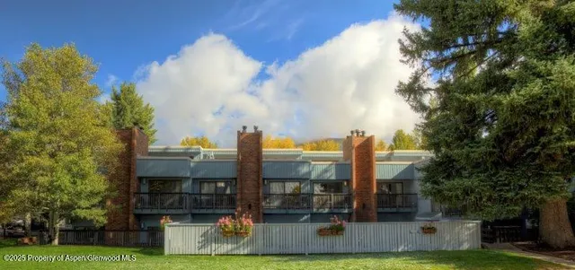 a view of a building with a yard