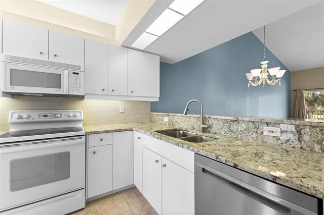 a view of a lake with houses in the back