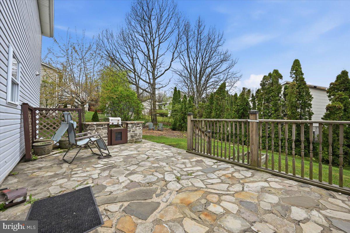 30 Freedom Street Hazleton, PA 18202 - Photo 57 of 84 Serene stone patio with lush greenery.