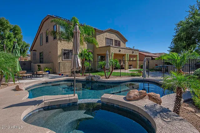 a front view of house with yard and outdoor seating