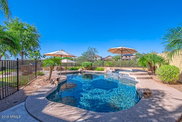 a view of a swimming pool with a patio