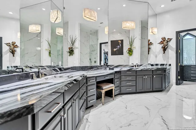 a large kitchen with a stove and cabinets