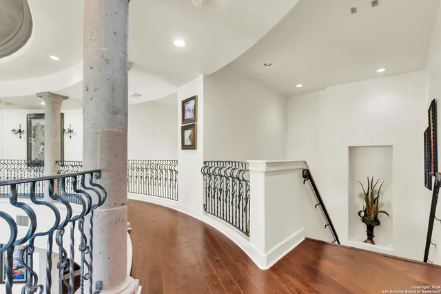 a view of an entryway with wooden floor