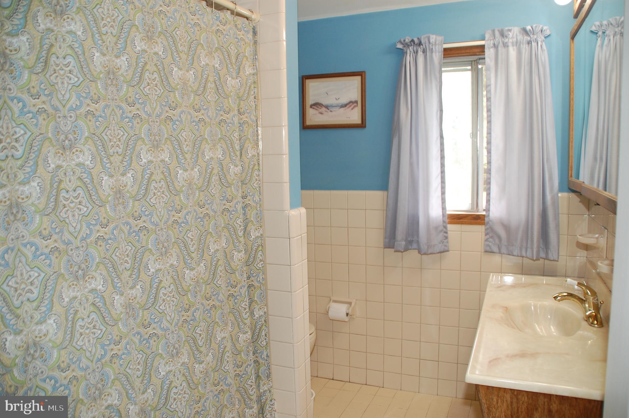 1366 Nevarc Road Warminster, PA 18974 - Photo 22 of 39 Hall Bath finished in ceramic tile.