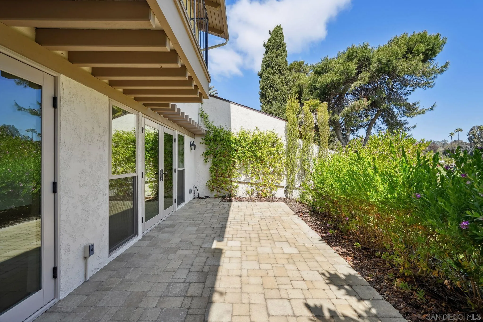 211 Via Osuna Rancho Santa Fe, CA 92091 - Photo 14 of 32 a view of a patio with table and chairs and potted plants
