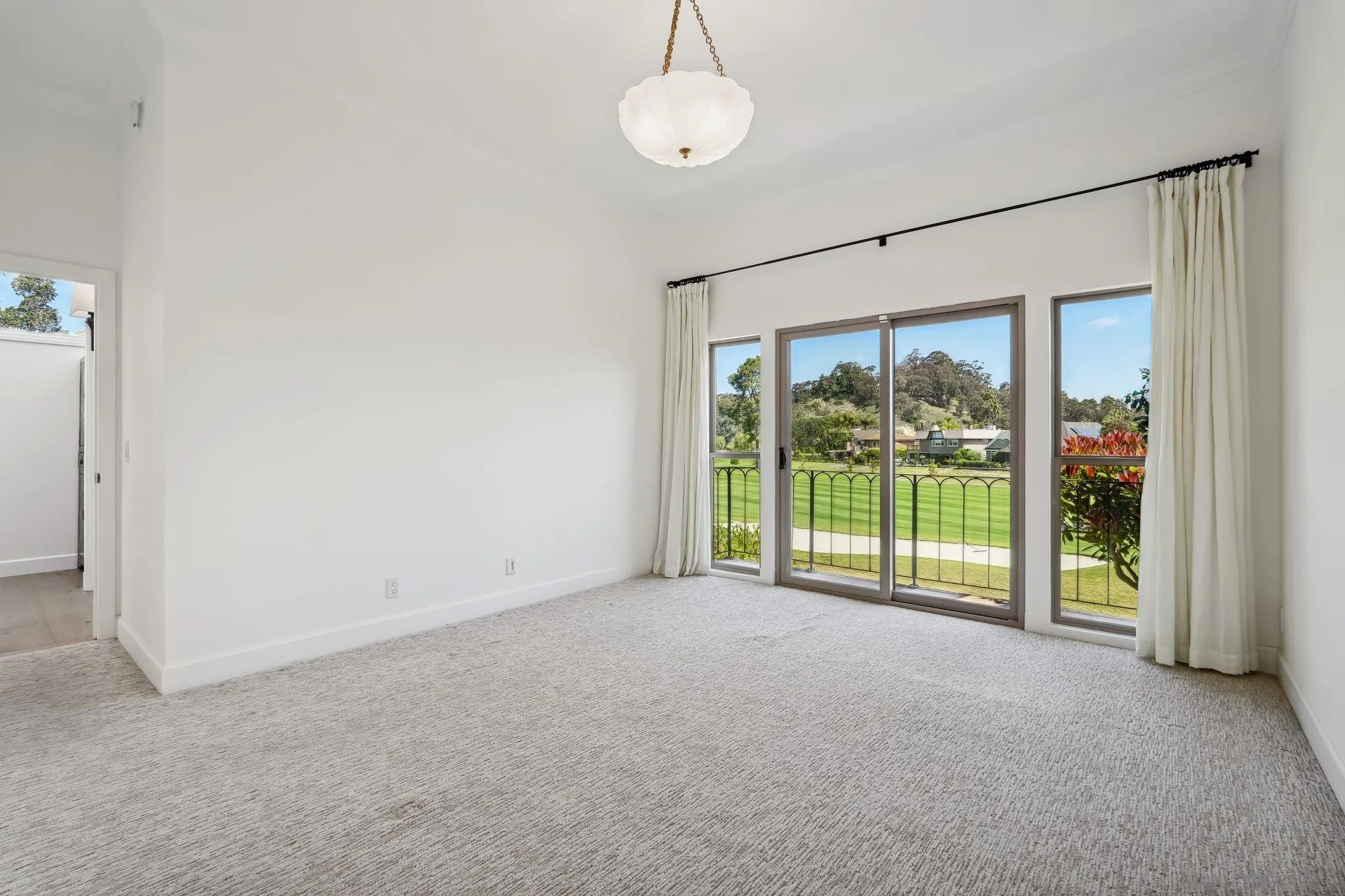 211 Via Osuna Rancho Santa Fe, CA 92091 - Photo 21 of 32 a view of an empty room with glass door and balcony