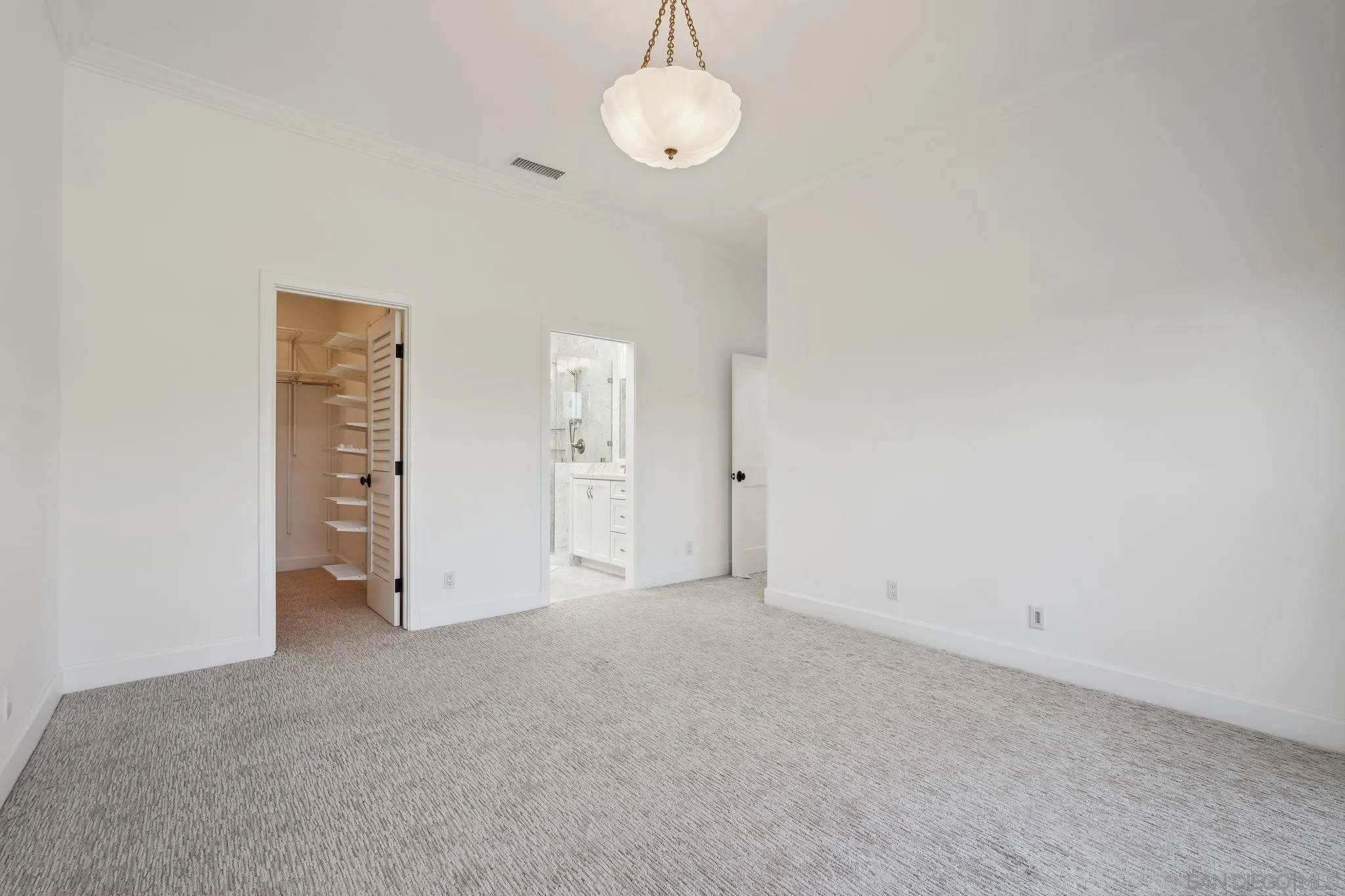 211 Via Osuna Rancho Santa Fe, CA 92091 - Photo 23 of 32 an empty room with closet area and mirror