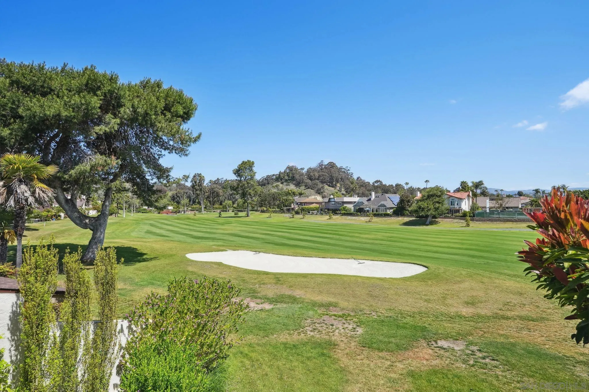 211 Via Osuna Rancho Santa Fe, CA 92091 - Photo 30 of 32 a view of a golf course with a lake