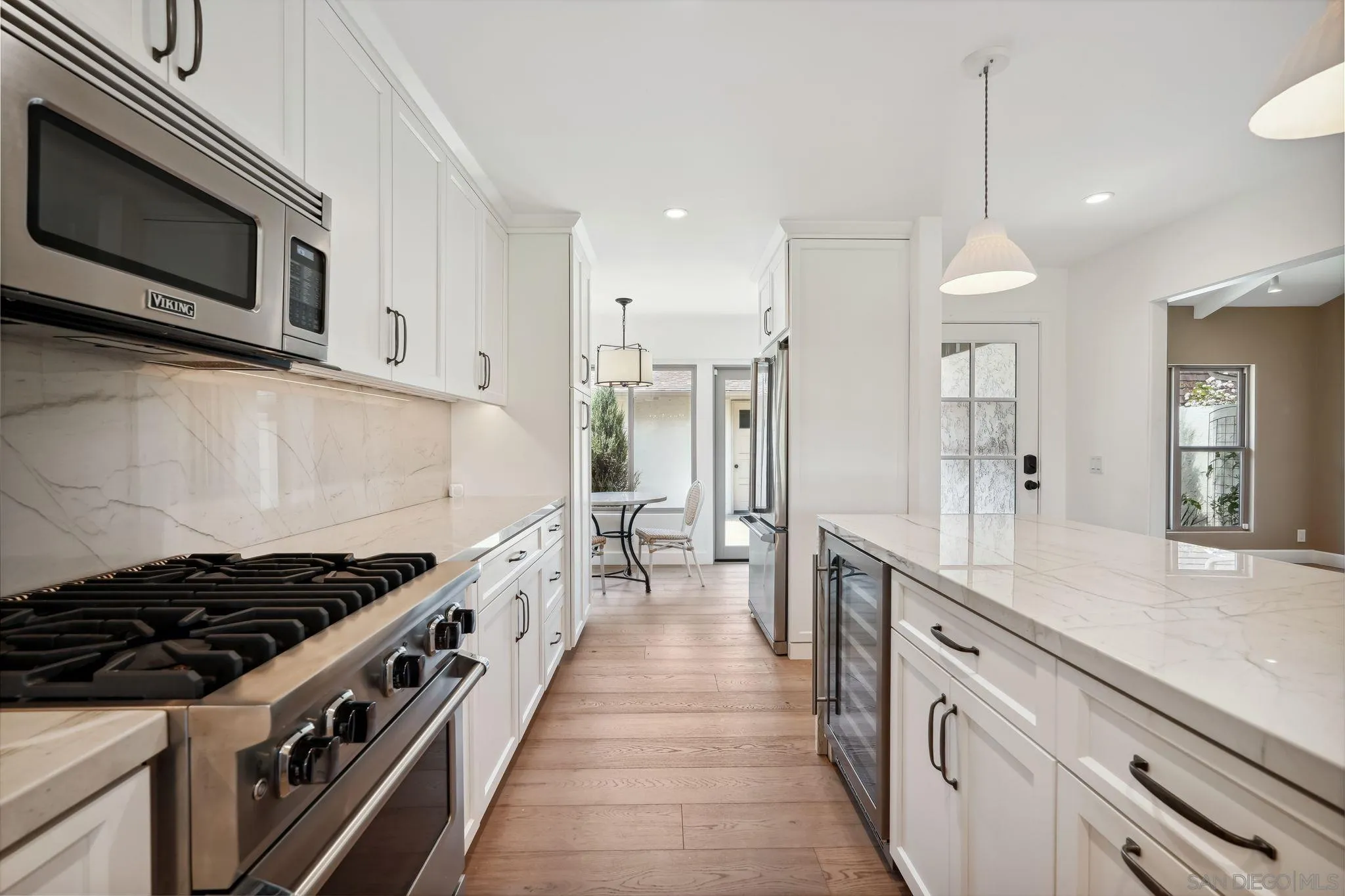 211 Via Osuna Rancho Santa Fe, CA 92091 - Photo 3 of 32 a large kitchen with stainless steel appliances granite countertop a stove a sink and a microwave