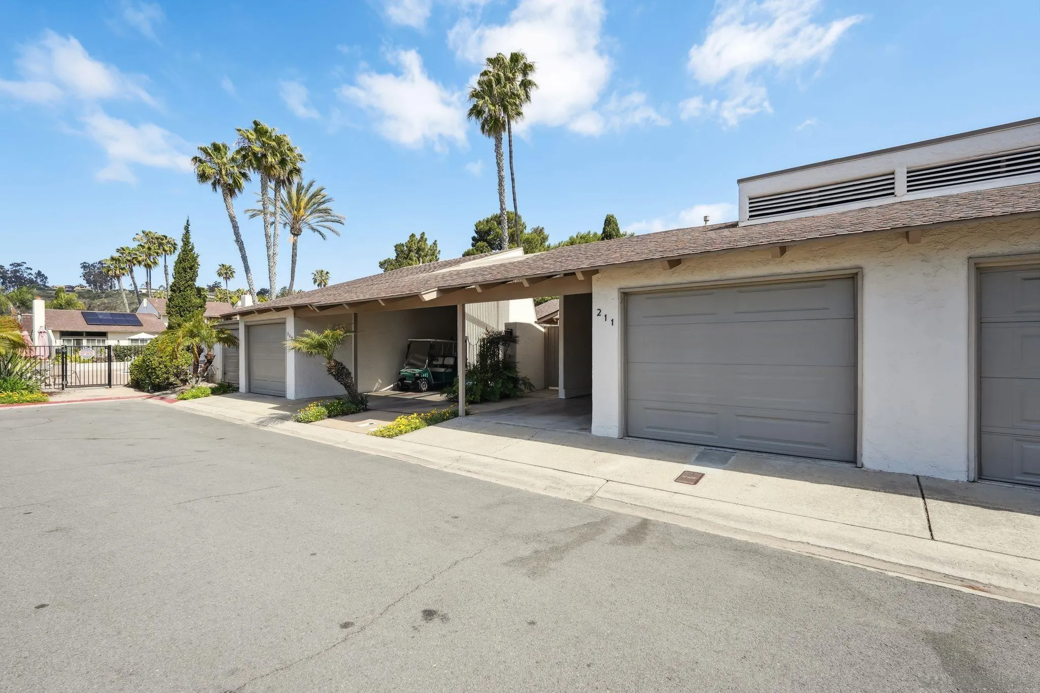 211 Via Osuna Rancho Santa Fe, CA 92091 - Photo 32 of 32 a view of a house with a garage and potted plants