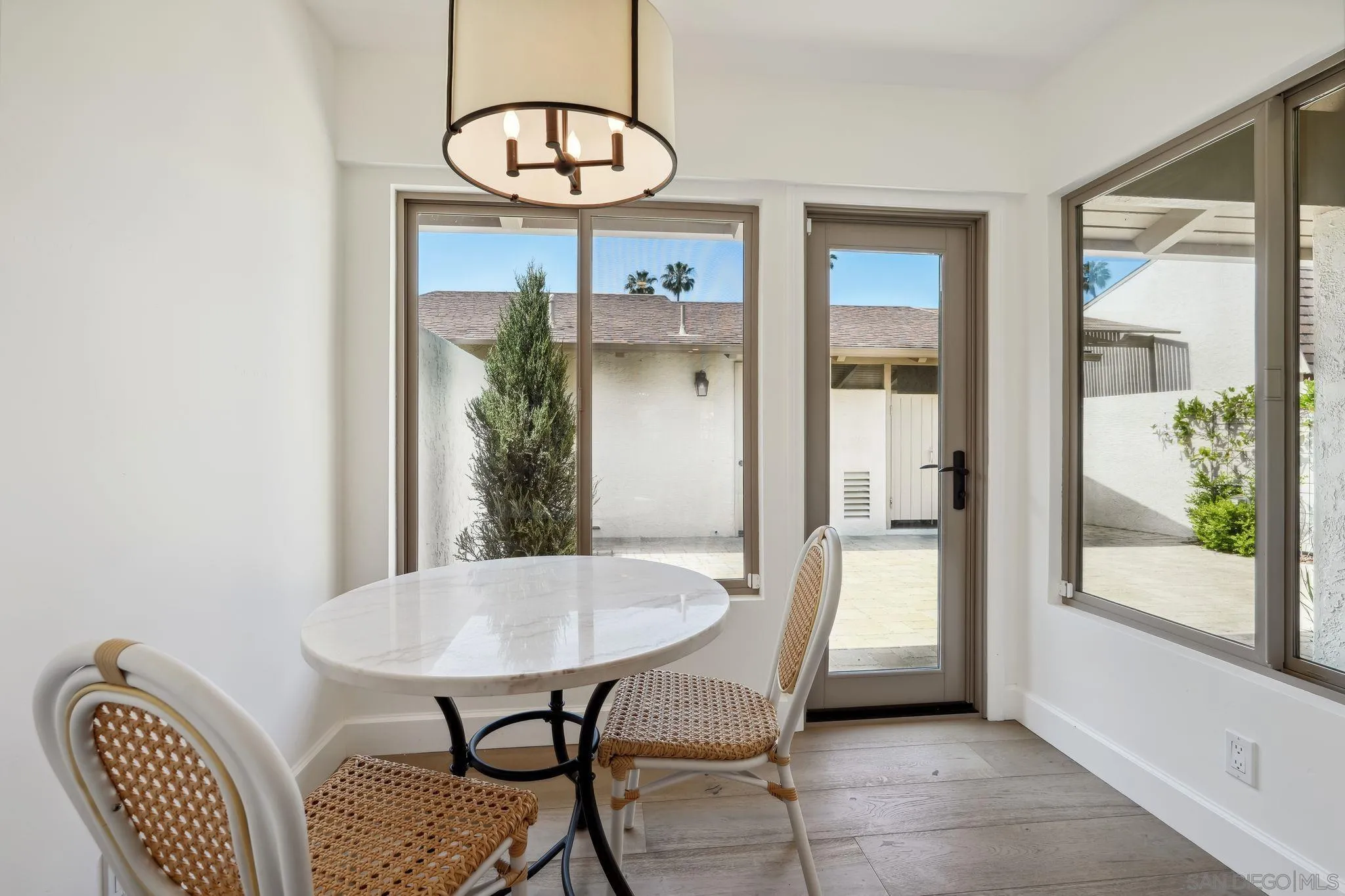 211 Via Osuna Rancho Santa Fe, CA 92091 - Photo 4 of 32 a view of a dining room with furniture window and wooden floor
