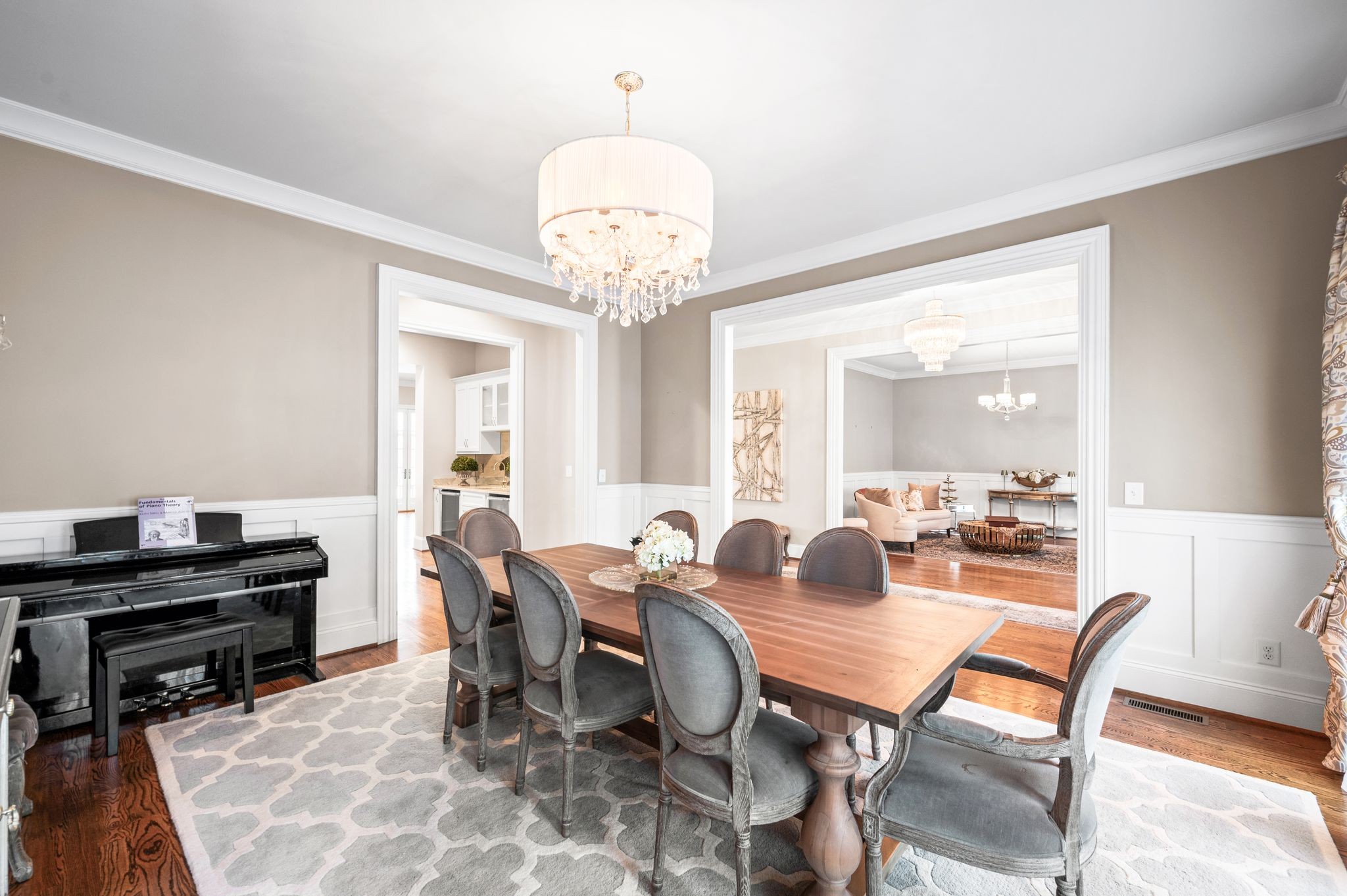 3509 Trimble Road Nashville, TN 37215 - Photo 13 of 80 a dining room with wooden floor a chandelier a wooden table and chairs