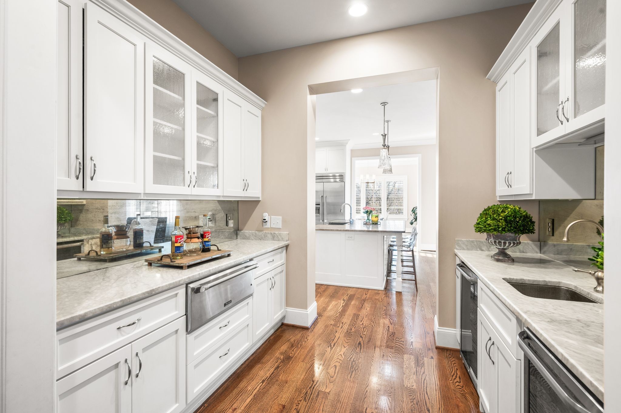 3509 Trimble Road Nashville, TN 37215 - Photo 15 of 80 a kitchen with a white cabinets and wooden floor