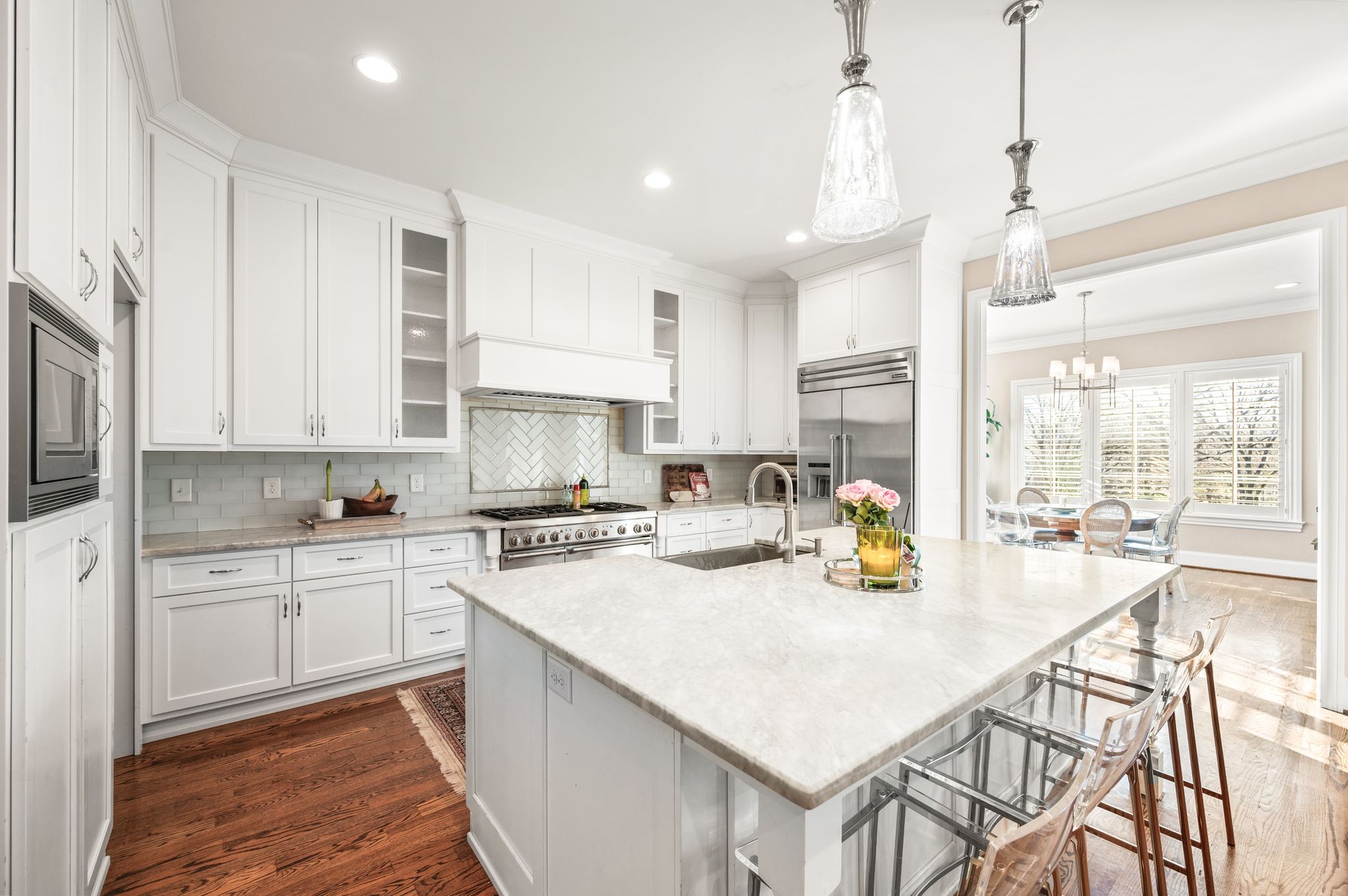 3509 Trimble Road Nashville, TN 37215 - Photo 26 of 80 a kitchen with a stove a sink a center island and cabinets