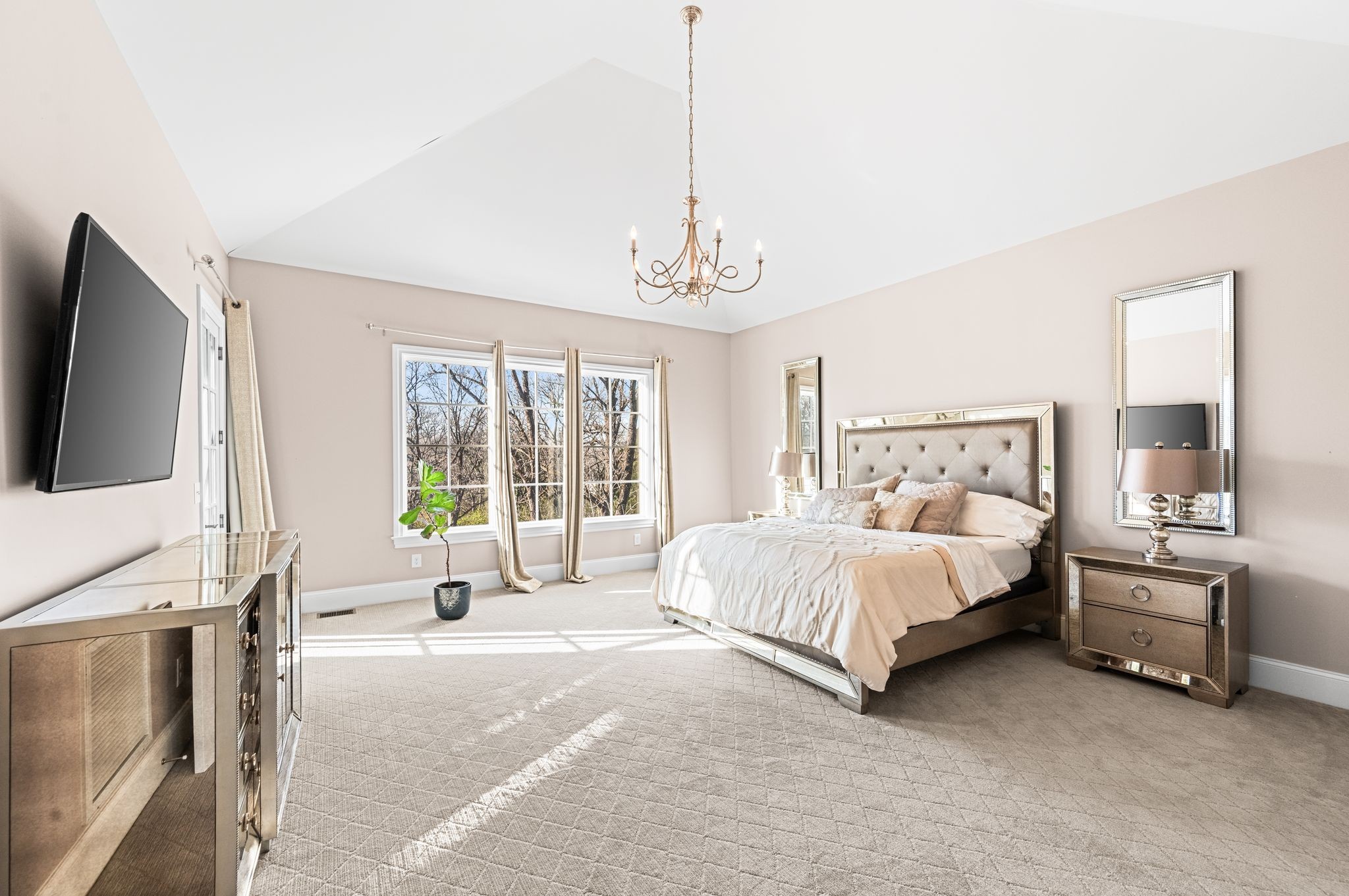 3509 Trimble Road Nashville, TN 37215 - Photo 38 of 80 a spacious bedroom with a bed and a flat tv screen on the dresser