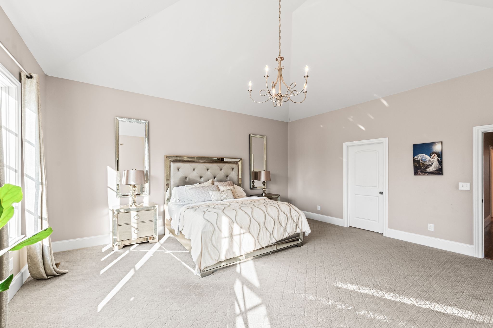 3509 Trimble Road Nashville, TN 37215 - Photo 39 of 80 a bedroom with a bed and a chandelier