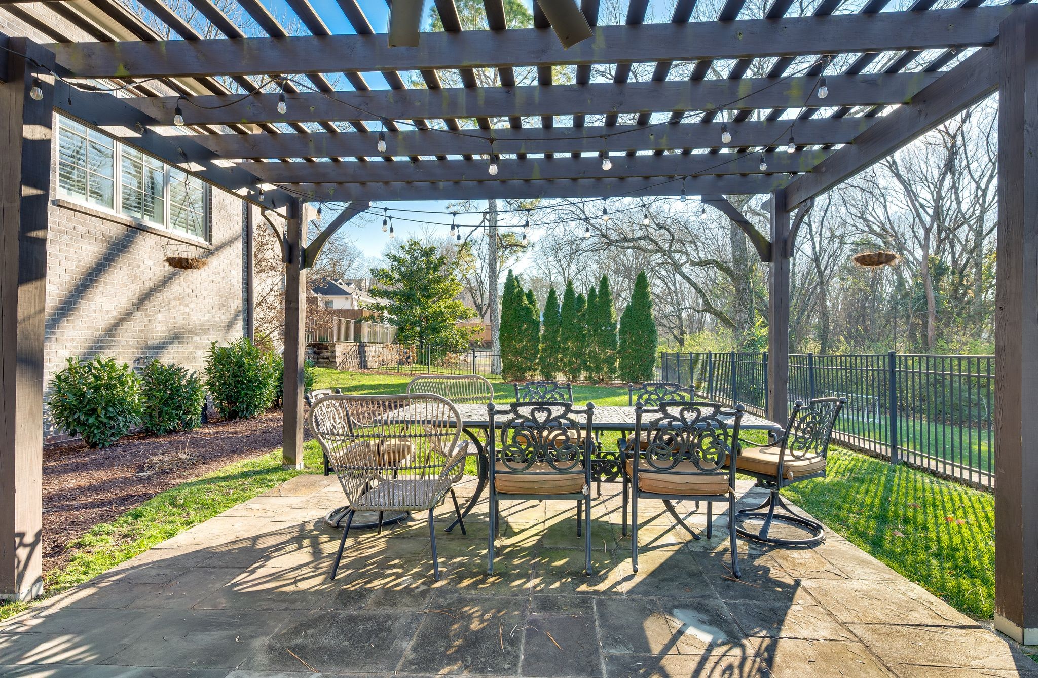 3509 Trimble Road Nashville, TN 37215 - Photo 70 of 80 a view of a patio with a table chairs and a backyard