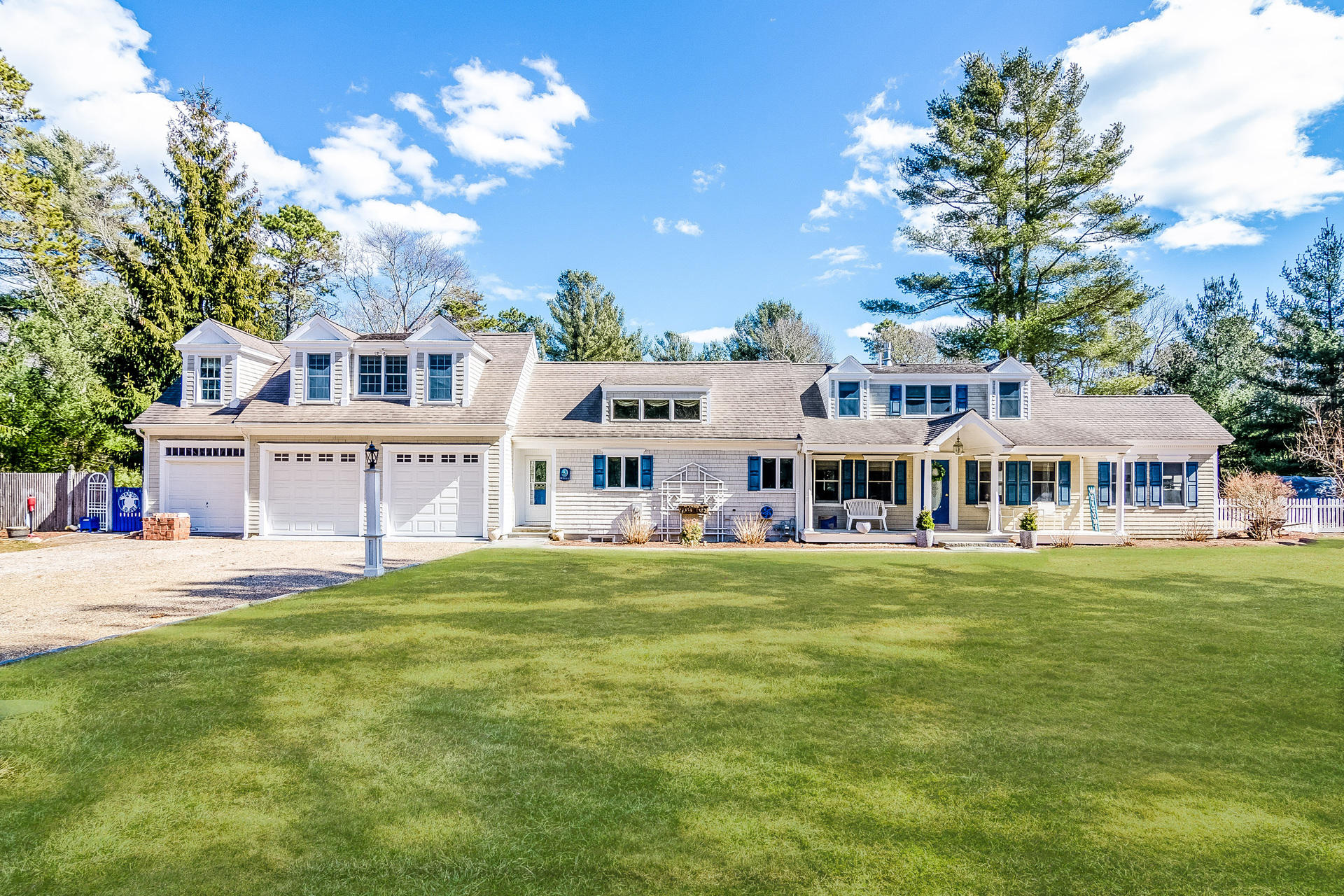 568 Santuit Road Cotuit, MA 02635 - Photo 1 of 30 a view of a house with a big yard and large trees