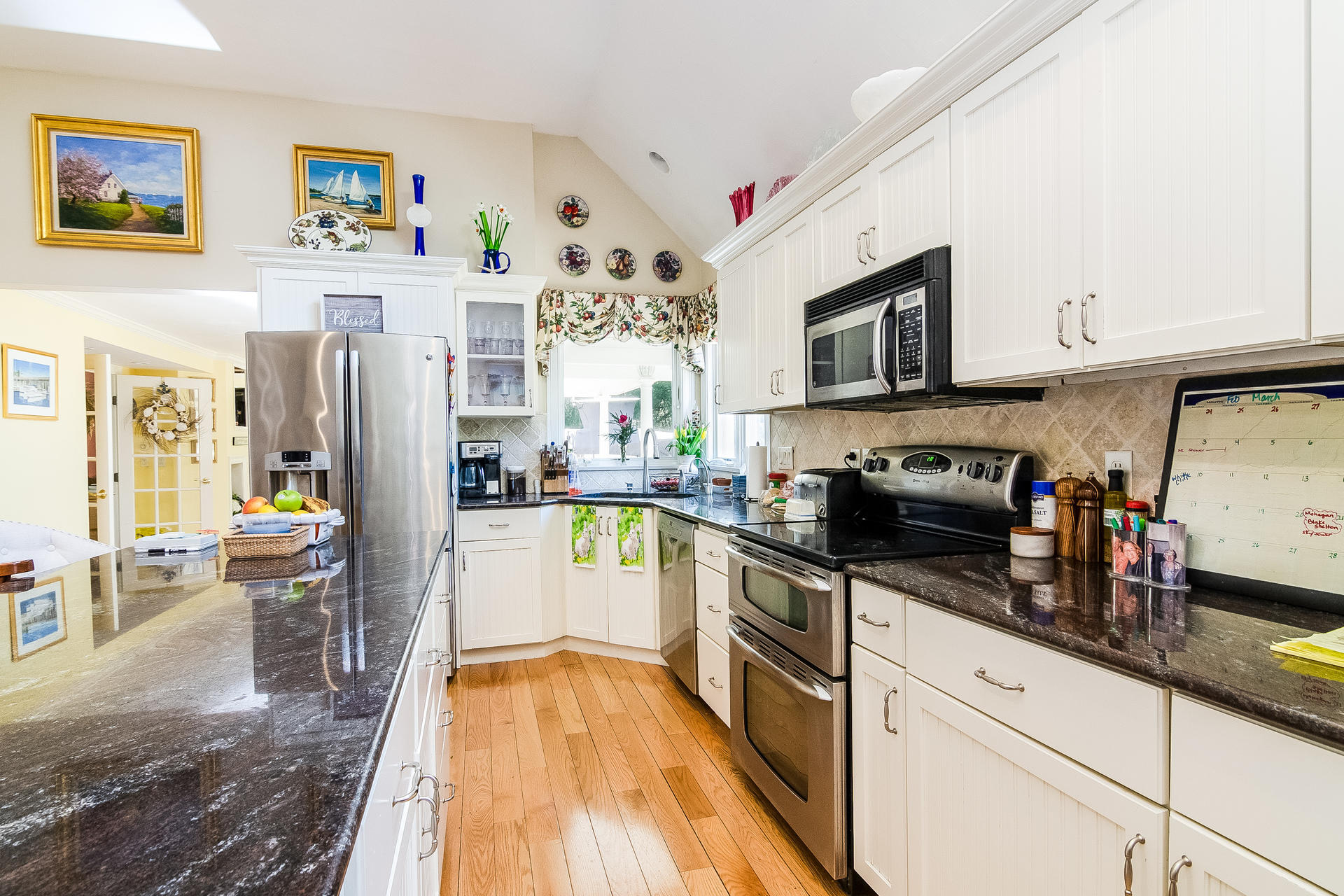 568 Santuit Road Cotuit, MA 02635 - Photo 13 of 30 a kitchen with stainless steel appliances granite countertop a refrigerator stove microwave and sink