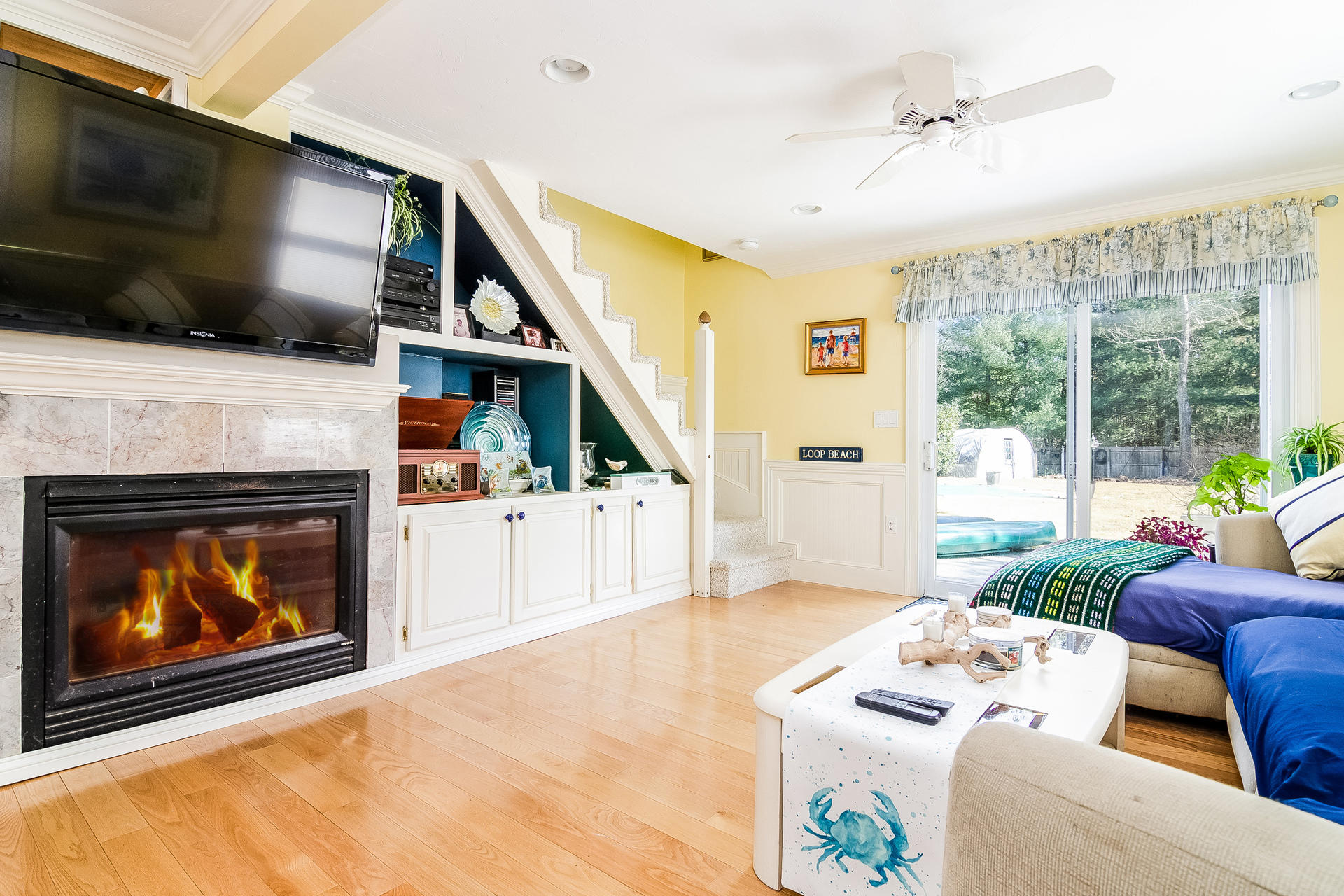 568 Santuit Road Cotuit, MA 02635 - Photo 16 of 30 a living room with furniture fireplace and flat screen tv