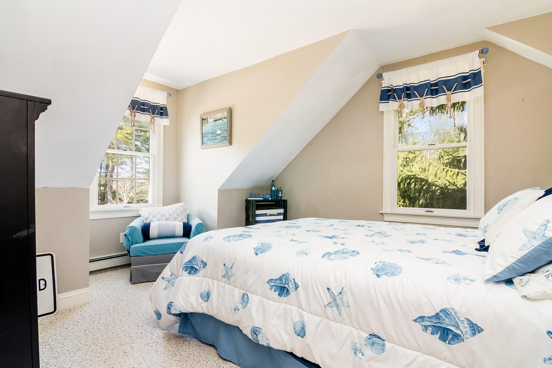 568 Santuit Road Cotuit, MA 02635 - Photo 20 of 30 a bedroom with a bed wooden floor and window