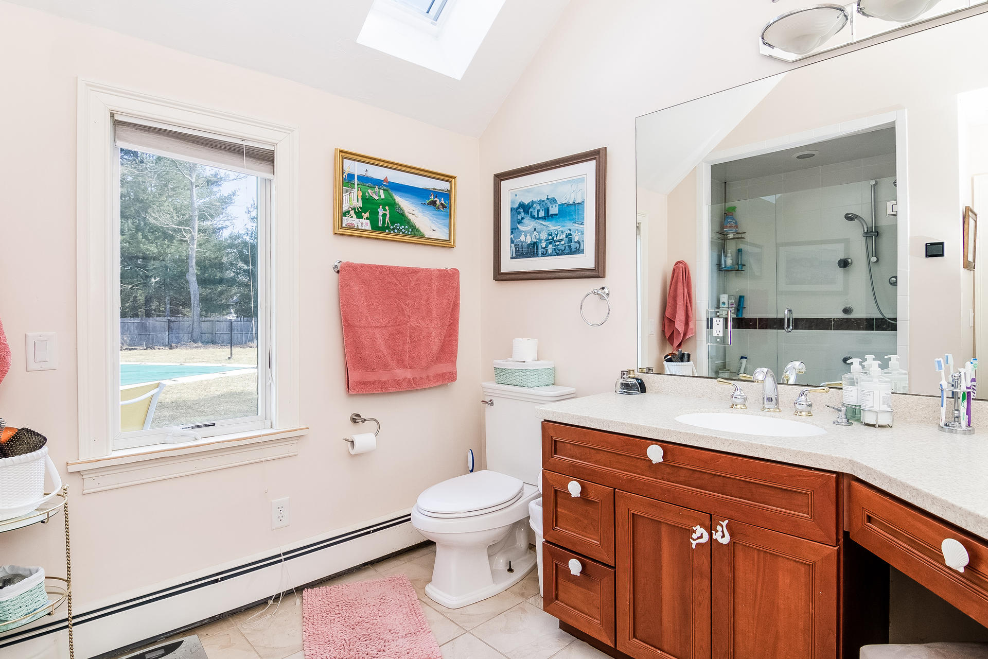568 Santuit Road Cotuit, MA 02635 - Photo 29 of 30 a bathroom with a toilet a sink a mirror and a window