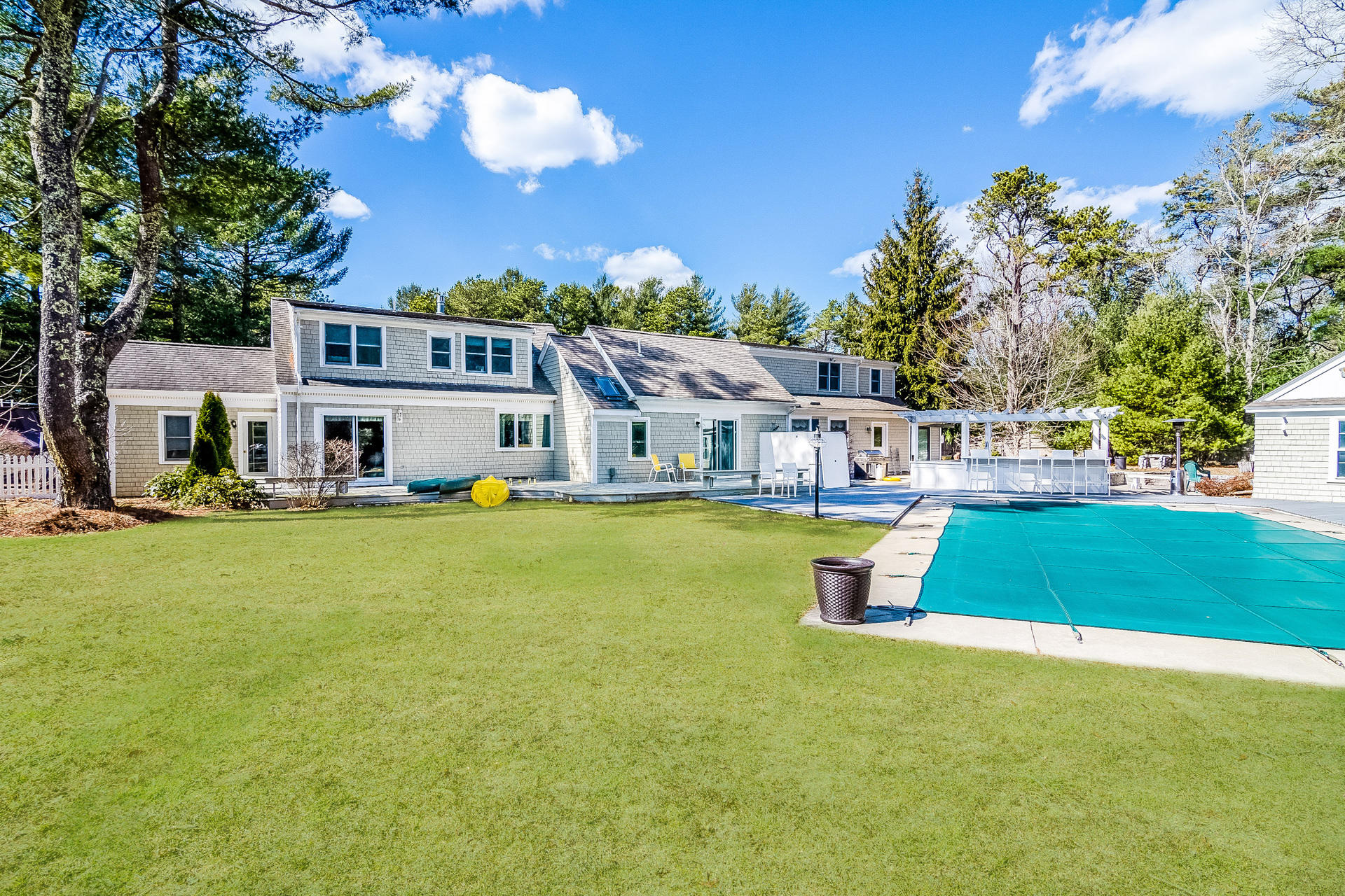 568 Santuit Road Cotuit, MA 02635 - Photo 7 of 30 a view of a house with swimming pool and sitting area