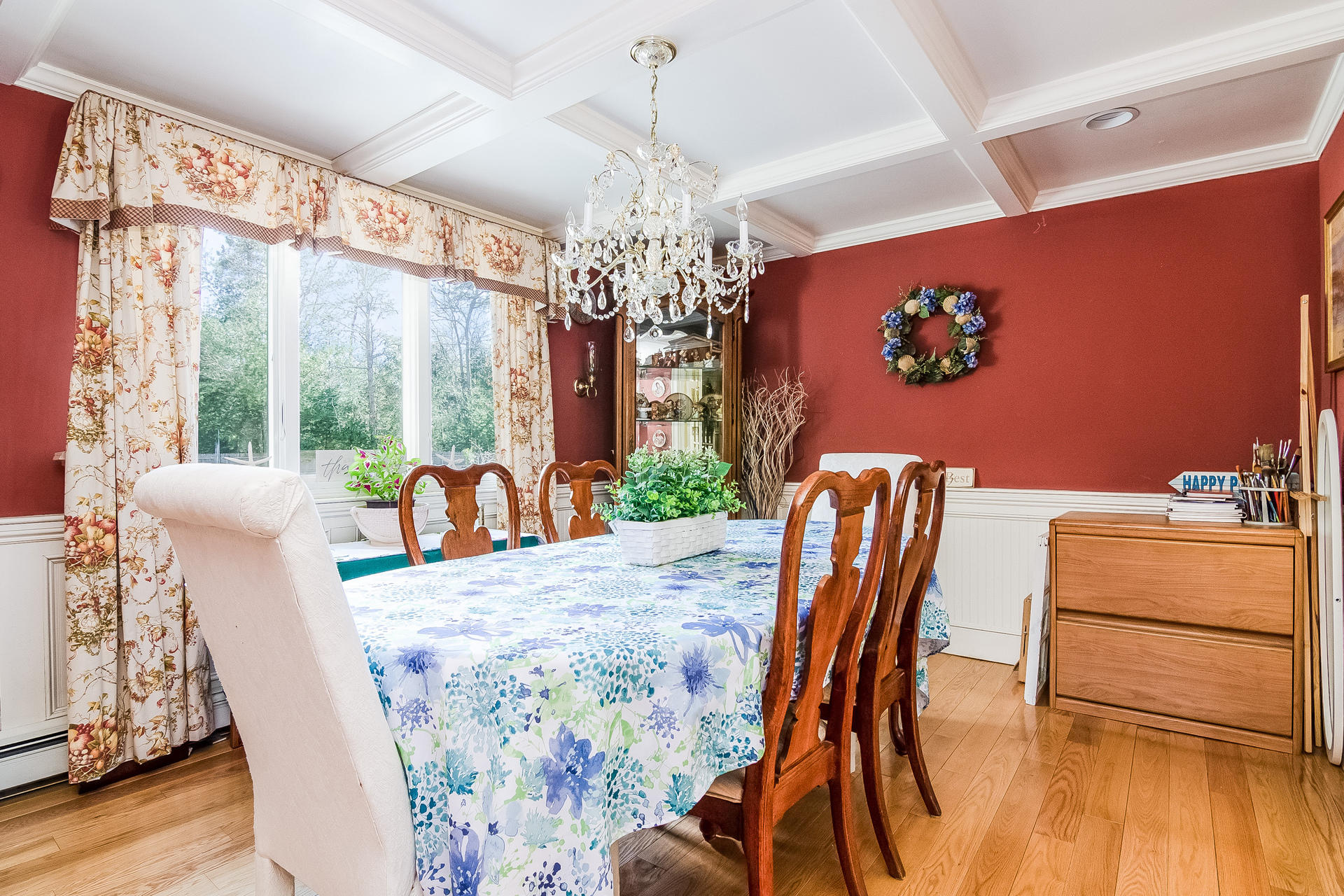 568 Santuit Road Cotuit, MA 02635 - Photo 10 of 30 a dining room with furniture a chandelier and wooden floor
