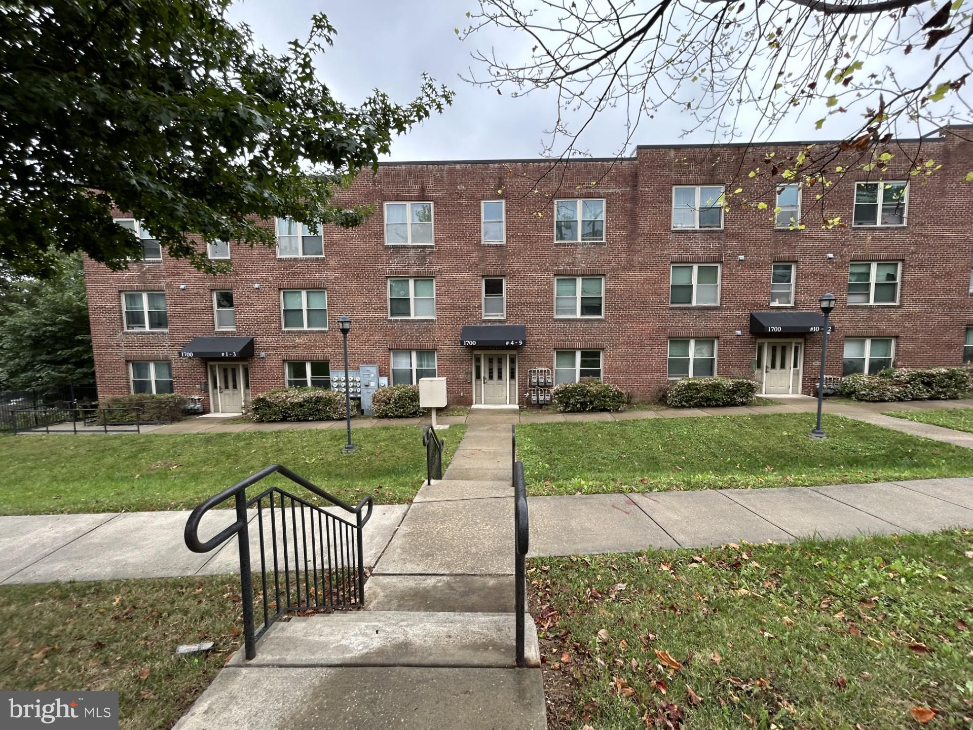 1700 W Street Southeast, Unit 5 Washington, DC 20020 - Photo 1 of 15 a front view of a house with garden