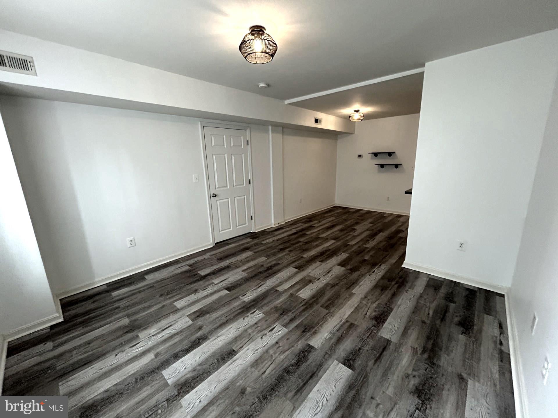 1700 W Street Southeast, Unit 5 Washington, DC 20020 - Photo 5 of 15 a view of a room with wooden floor