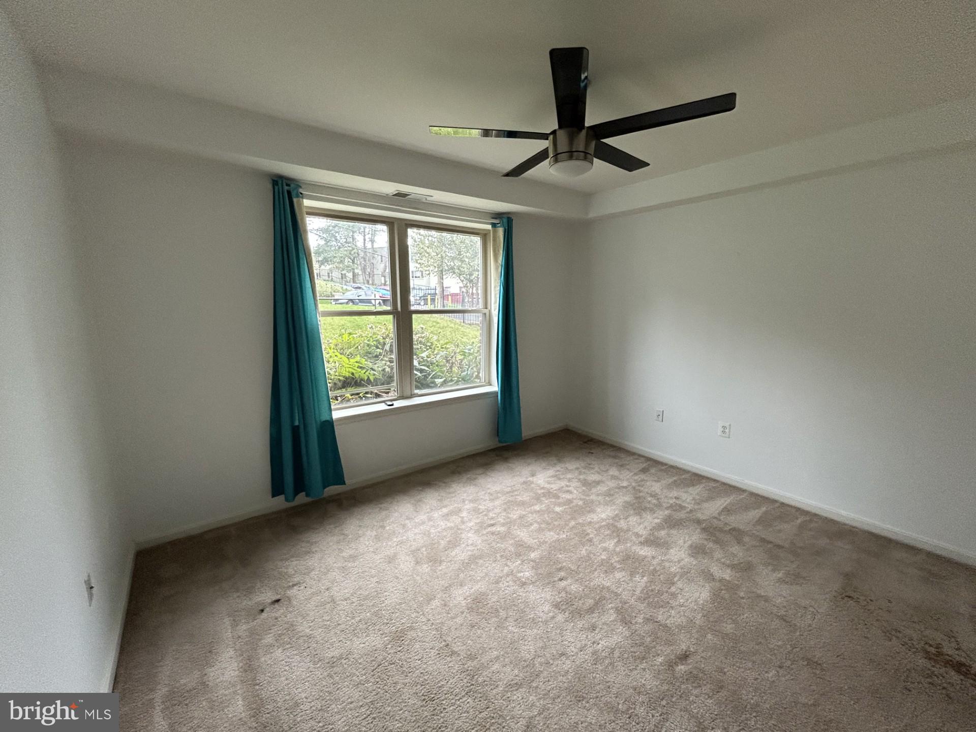 1700 W Street Southeast, Unit 5 Washington, DC 20020 - Photo 9 of 15 a view of an empty room with a window