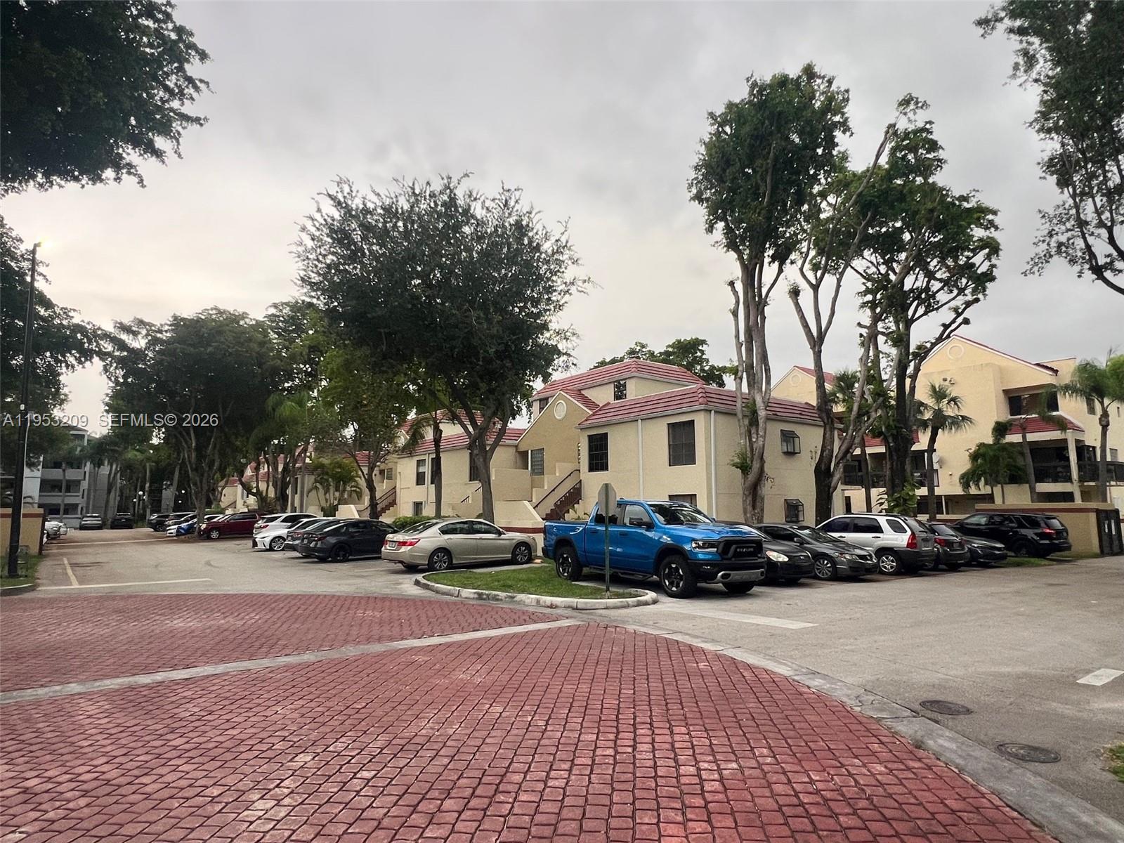 8831 Southwest 130th Place, Unit 106 Miami, FL 33186 - Photo 14 of 15 a view of a street with cars on road
