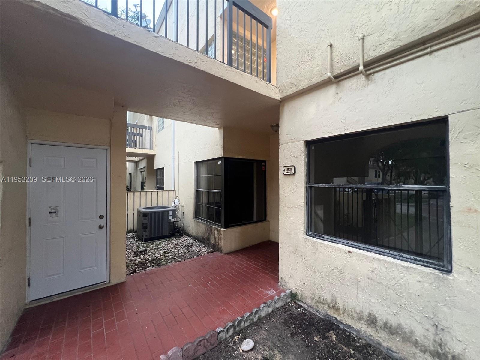 8831 Southwest 130th Place, Unit 106 Miami, FL 33186 - Photo 15 of 15 a kitchen with a refrigerator and microwave