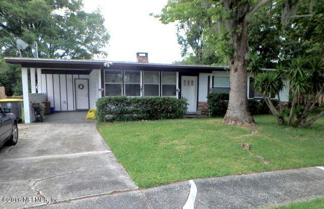 7448 Proxima Road Jacksonville, FL 32210 - Photo 1 of 14 front view of a house with a yard