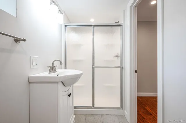a bathroom with a sink and mirror