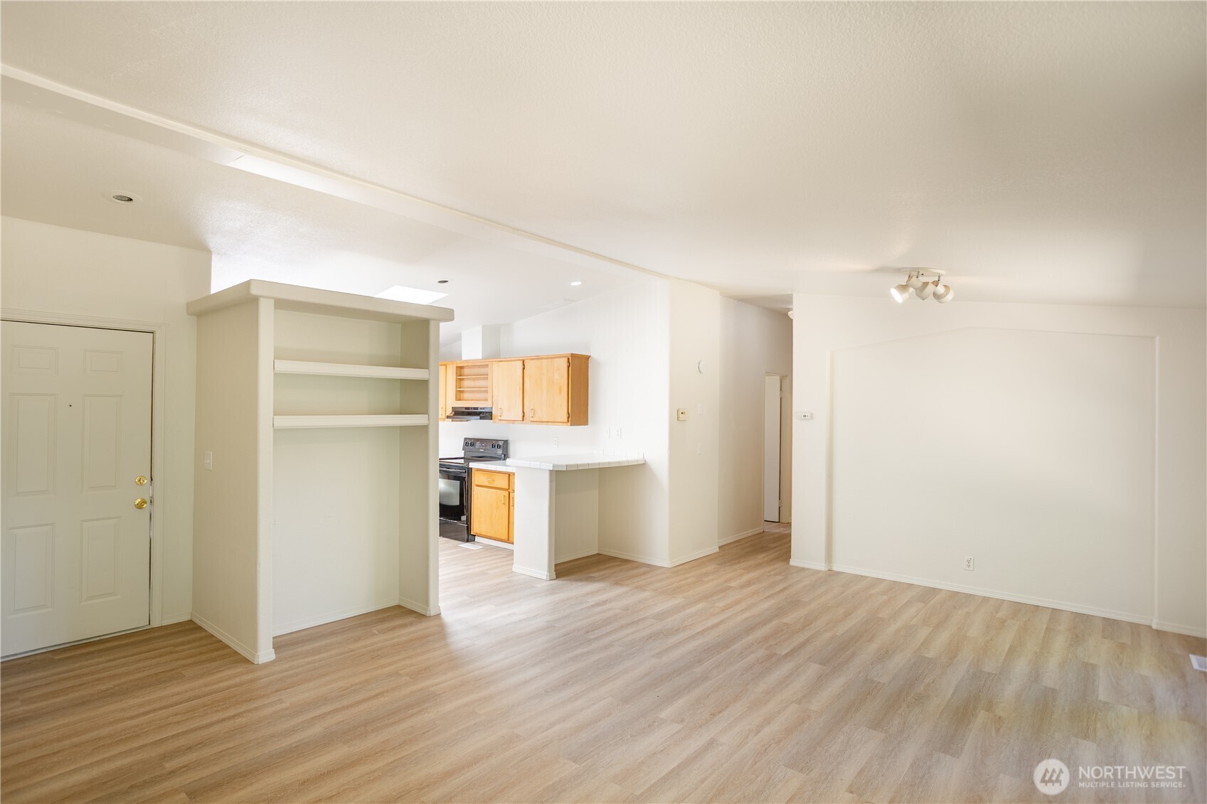 111 Spring Court Vader, WA 98593 - Photo 12 of 27 a view of a kitchen with wooden floor and a sink