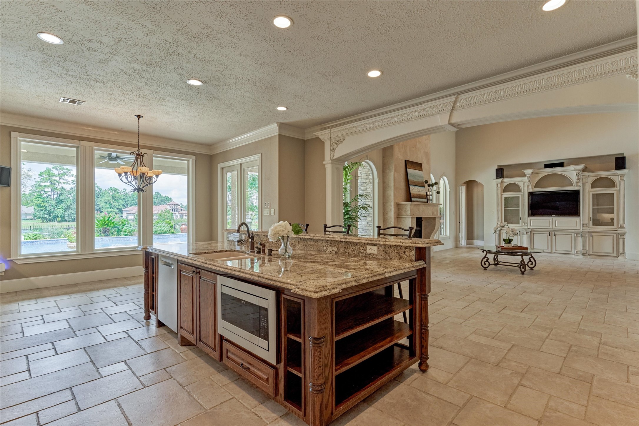 7806 Bent Green Lane Spring, TX 77389 - Photo 14 of 50 a room with furniture a flat screen tv and a floor to ceiling window