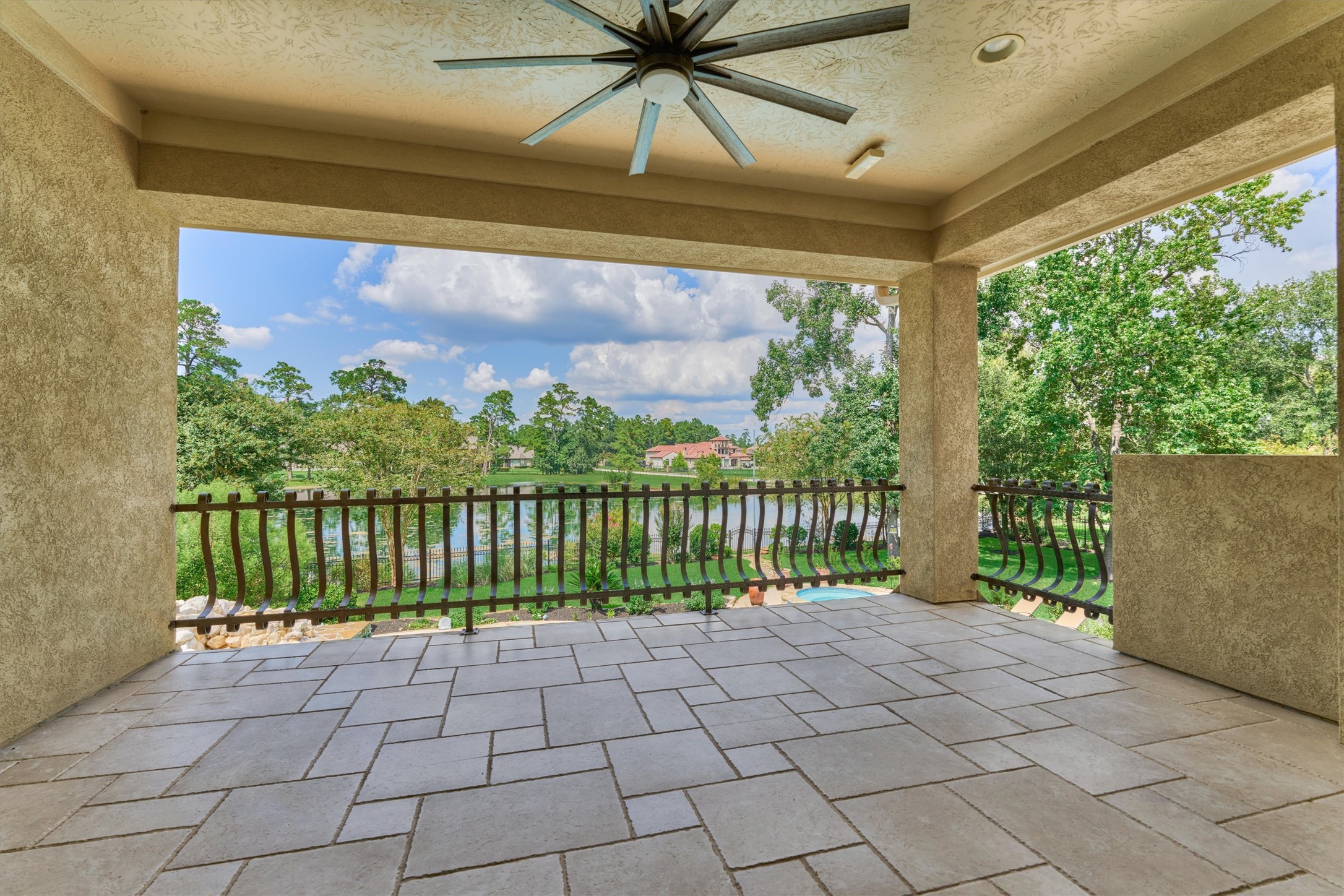 7806 Bent Green Lane Spring, TX 77389 - Photo 36 of 50 A large covered balcony from the billiards room offers spectacular views of the pool and lake, as well as ample room for relaxing and lounging!