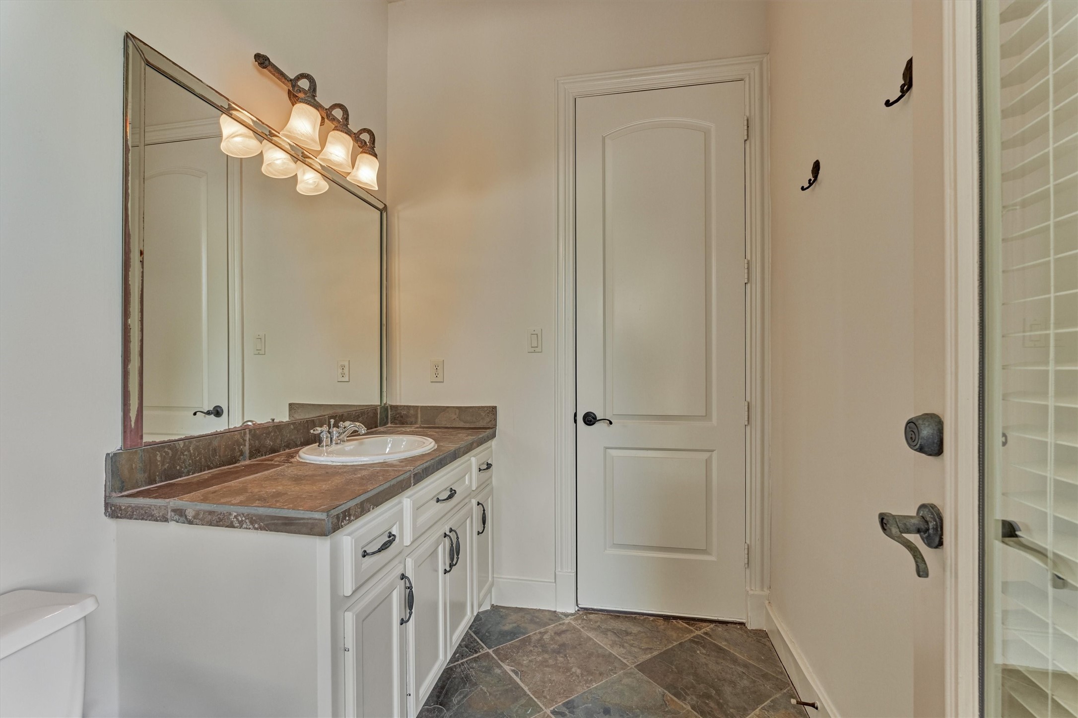 7806 Bent Green Lane Spring, TX 77389 - Photo 44 of 50 a bathroom with a sink a vanity and a mirror