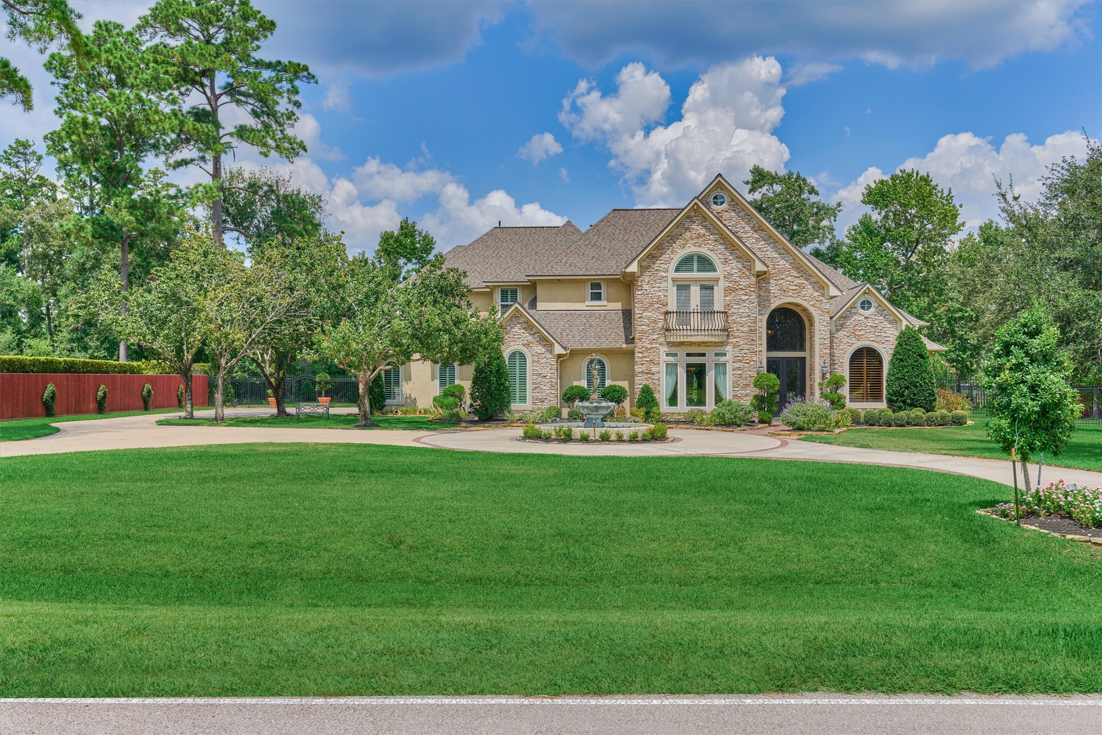 7806 Bent Green Lane Spring, TX 77389 - Photo 49 of 50 a front view of a house with garden and a tree