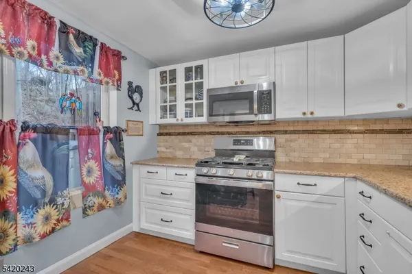 a view of a play room with furniture and toys
