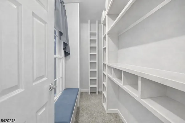 a bedroom with a bed and furniture