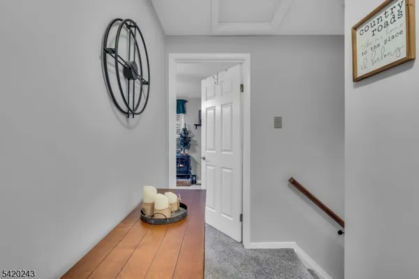 a bathroom with a toilet a sink and a mirror