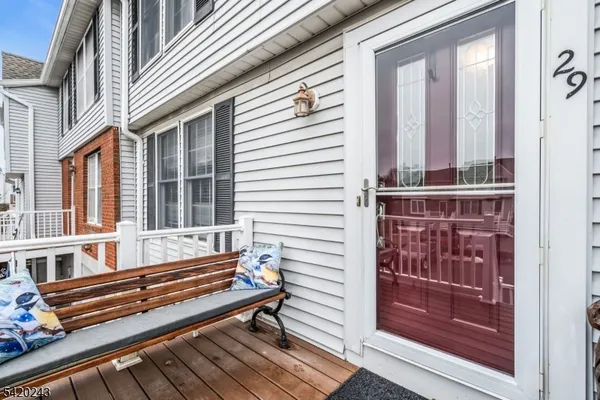 a view of a two chairs in the balcony