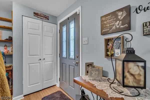 a view of a workspace with furniture and wooden floor